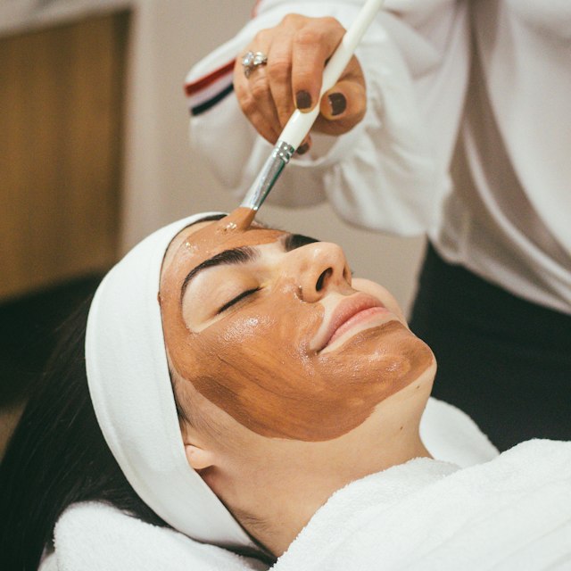 Rejuvenating facial skincare mask treatment at beauty salon